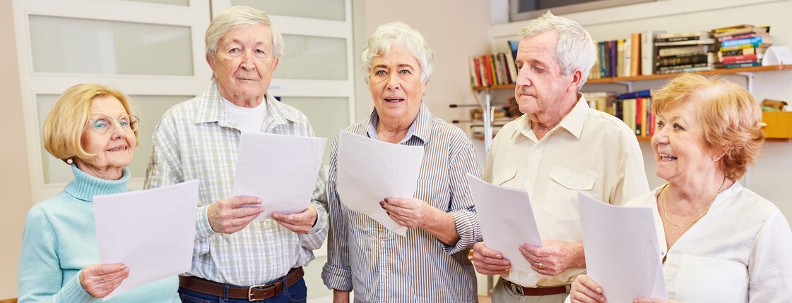 Group,Of,Seniors,With,Dementia,Singing,Together,In,A,Choir