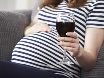 Close Up Of Pregnant Woman Drinking Red Wine Close Up Of Pregnant Woman Drinking Red Wine