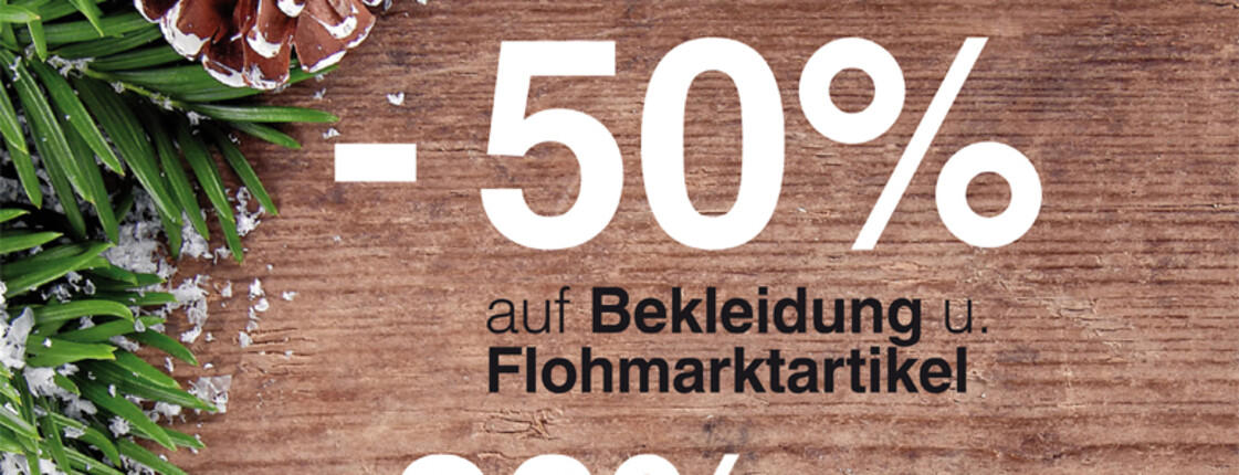 Carla Weihnachtsaktion. Die weißen Prozentreduzierungen sind in weiß gestaltet. Der Hintergrund ziert ein hölzerner Untergrund mit Tannenzapfen. 